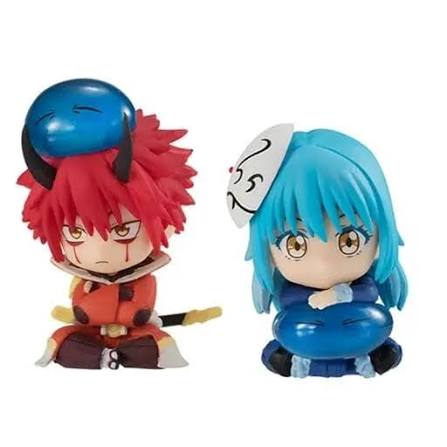 Two anime-style figurines with red and blue hair on a white background