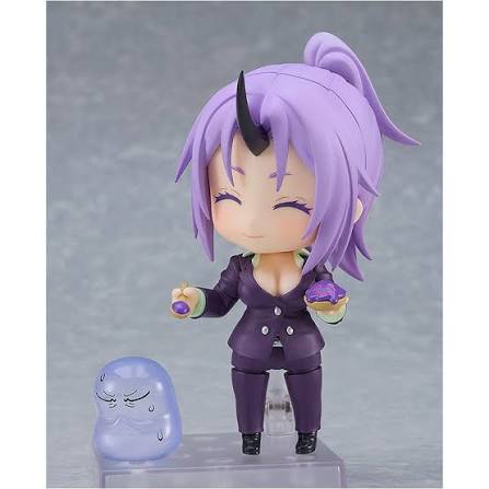 Nendoroid figurine with purple hair and outfit on a gray background